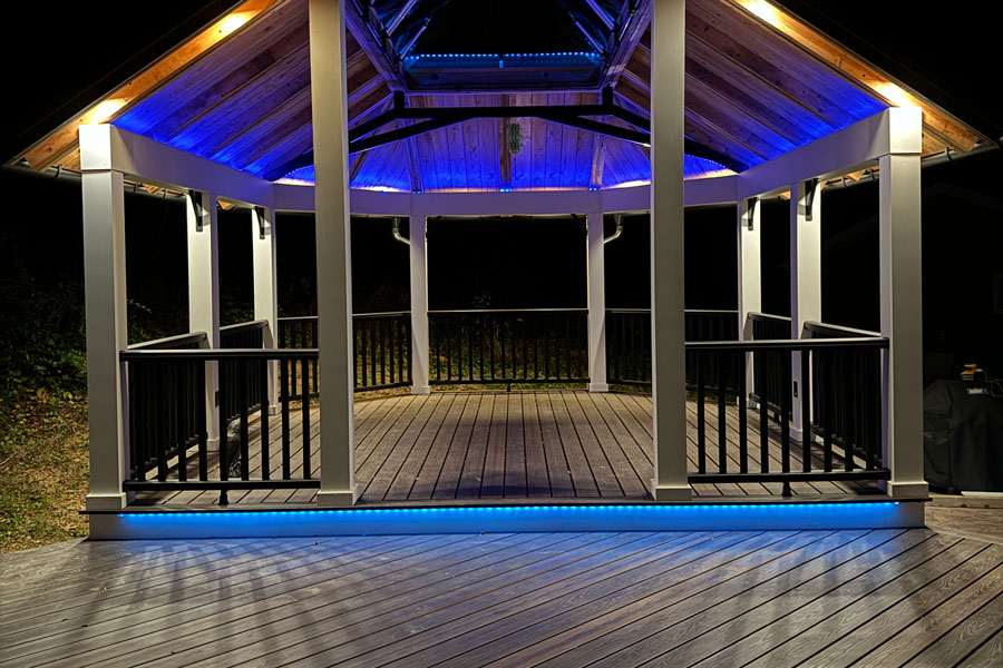 deck and pavilion lit up at night